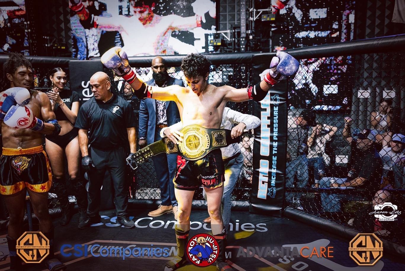 Chris Geliga – Muay Thai Champion and Personal Trainer Chris Geliga receiving a championship belt after a Muay Thai victory inside the cage.